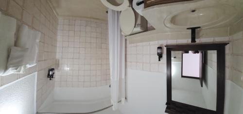 Find your quiet corner in our Cozy Full Bed Room at Selva Boutique Hotel, Luquillo. A comfortable full bed and private balcony await for your serene adults-only getaway in Puerto Rico.