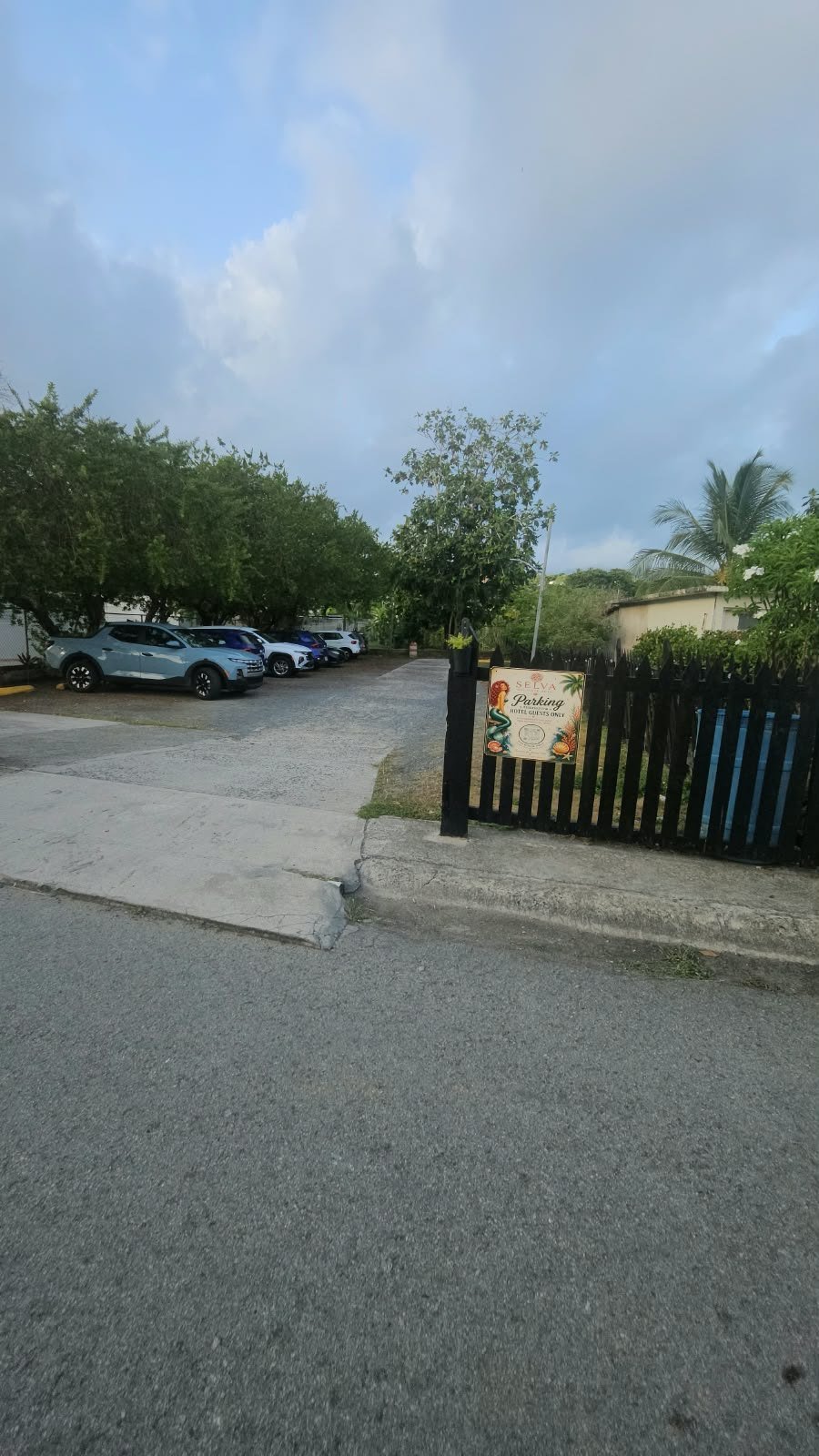 Selva's primary guest parking area with the Hotel Guests Only sign at the entrance
